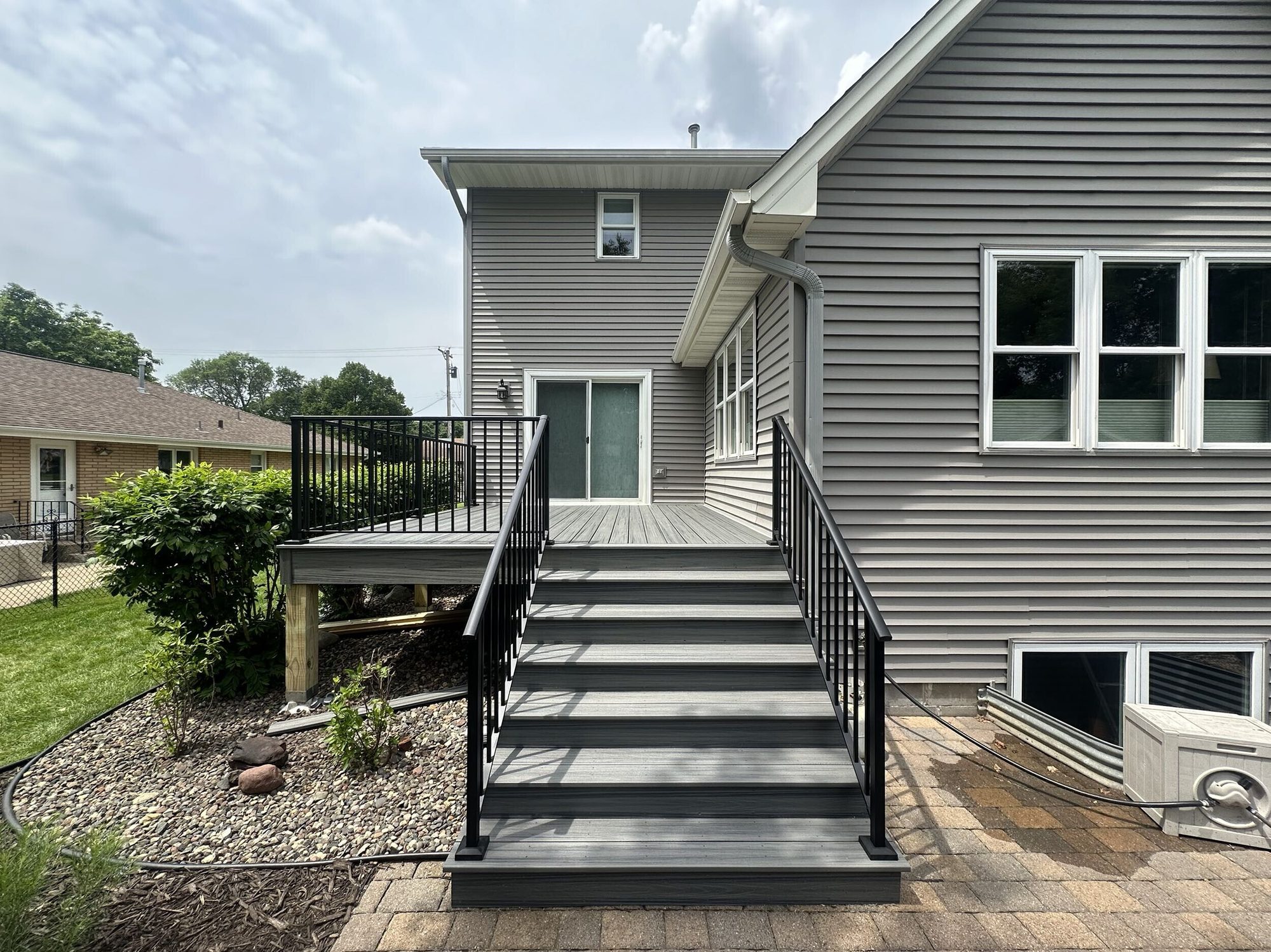 Trex Transcend deck in Tropical Island Mist with black aluminum railing in Lakeville, MN by BN Builders